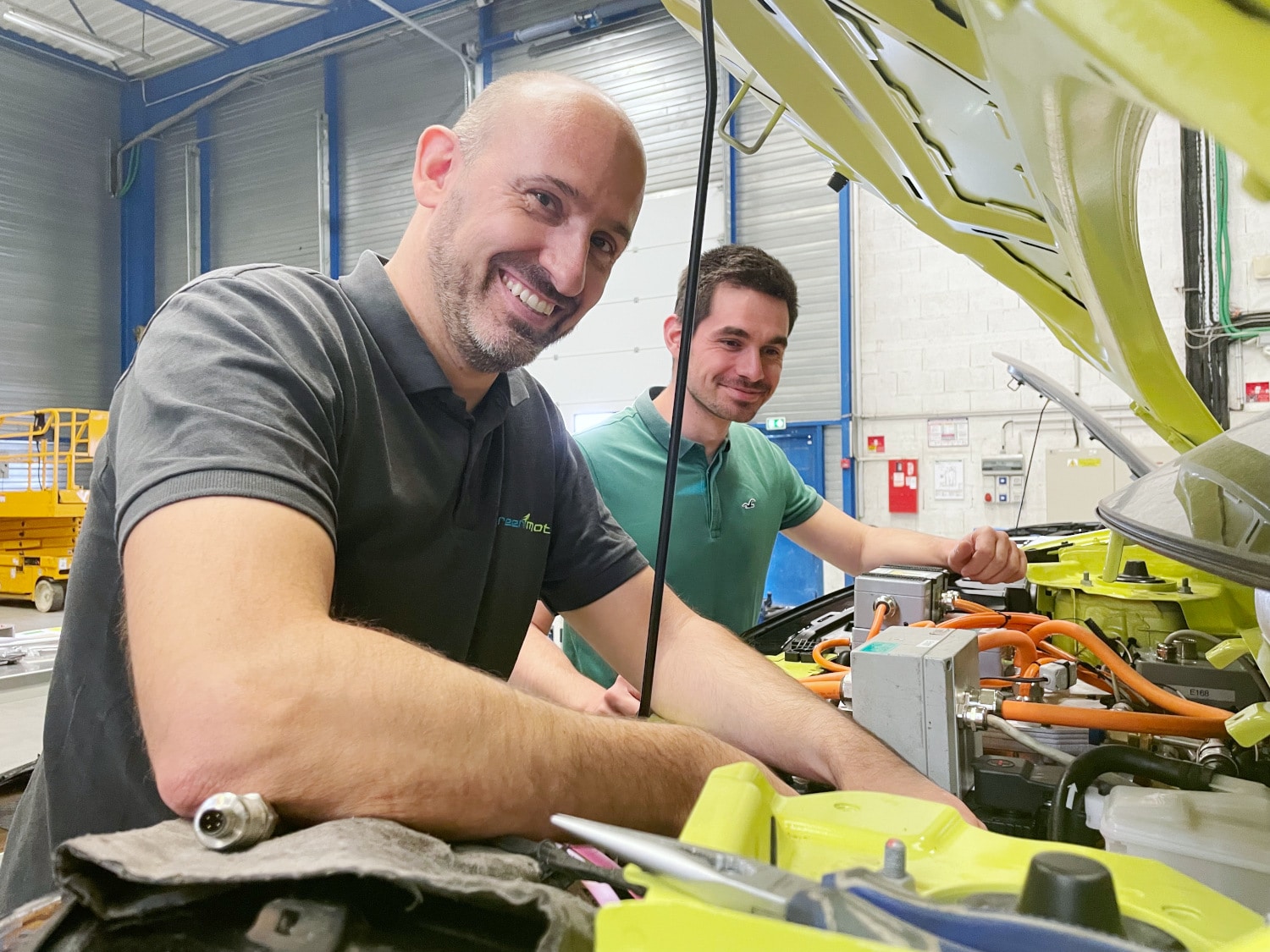 tom & cyril in the workshop working on a car